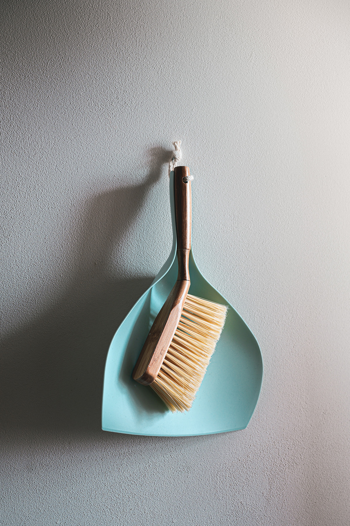 Pretty in Pink Cleaners' dustpan and broom - expert cleaning services in Staten Island.